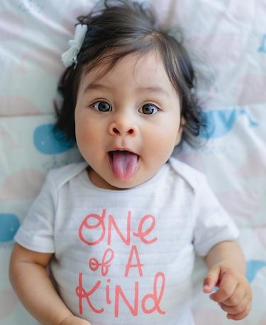 childrens dentist miami | baby sticking out tongue