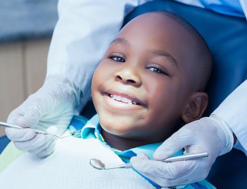 childrens root canal treatment miami | child at dentist
