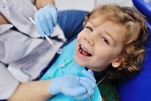 child dental care miami | kid at dentist