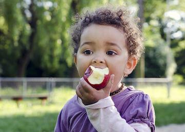 dentistry for children miami | boy eating apple