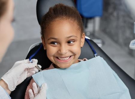 childrens tooth extraction miami | child at dentist