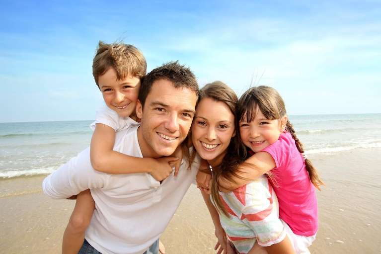childrens dentist miami | family at beach