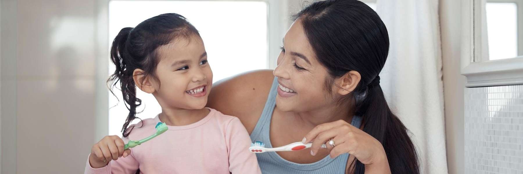 childrens dental exams miami | family brushing teeth